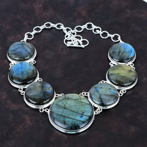 Necklace with Labradorite stones on a dark brown background