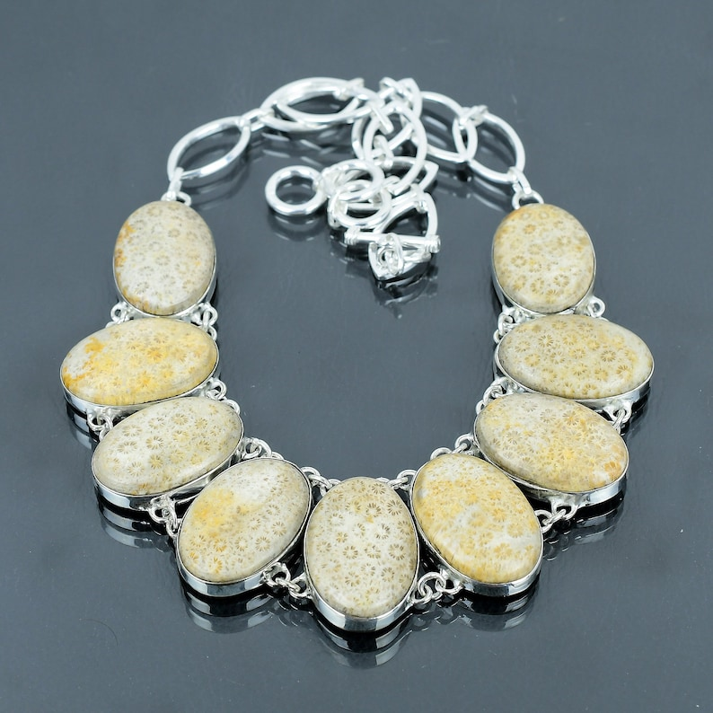 Necklace with stone pendants on a dark surface