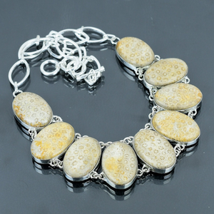 Necklace with stone-like beads on a dark surface