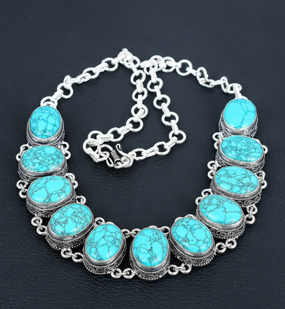 Necklace with turquoise stones on a dark background