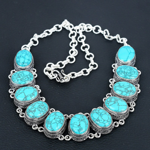 Necklace with turquoise stones on a dark background