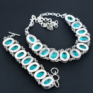 Silver bracelet with turquoise stones on a dark background