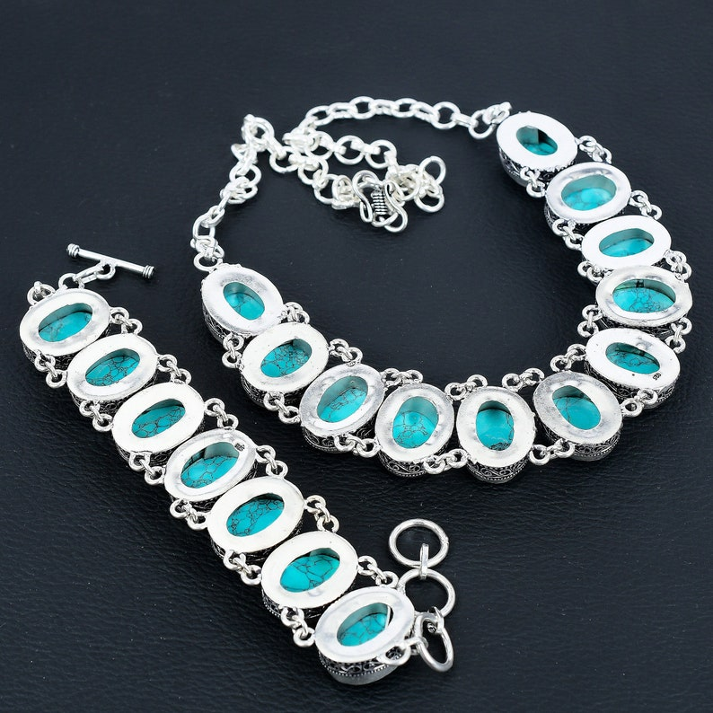 Silver bracelet with turquoise stones on a dark background