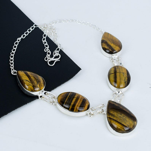 Necklace with tiger eye stones on a white background