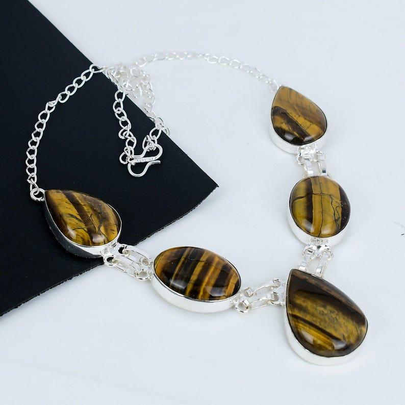 Necklace with tiger eye stones on a white background
