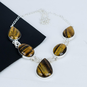 Necklace with tiger eye stones on a white background
