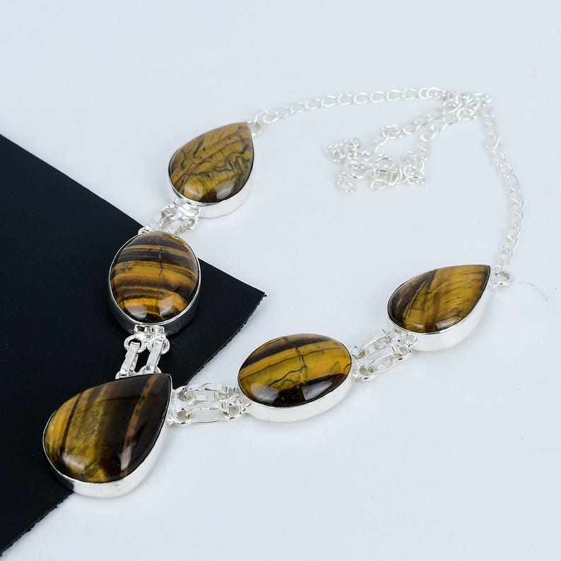 Necklace with tiger eye stones on a black and white background